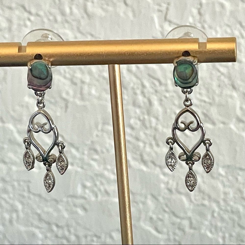 Small silver tone earrings with abalone